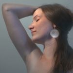 woman showing her hairless armpit